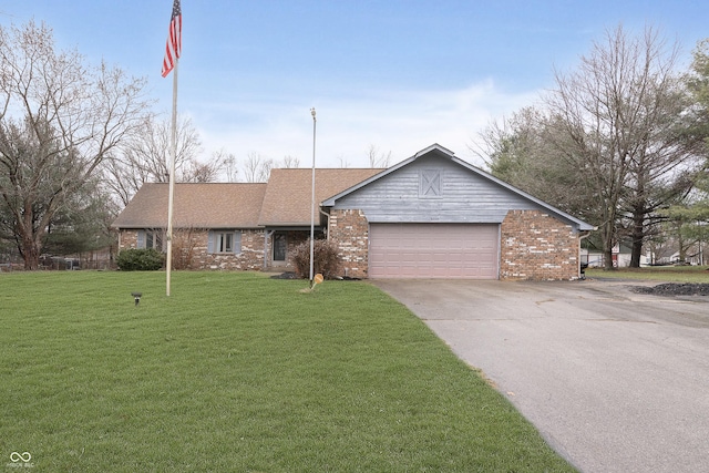 ranch-style house featuring a front yard and a garage