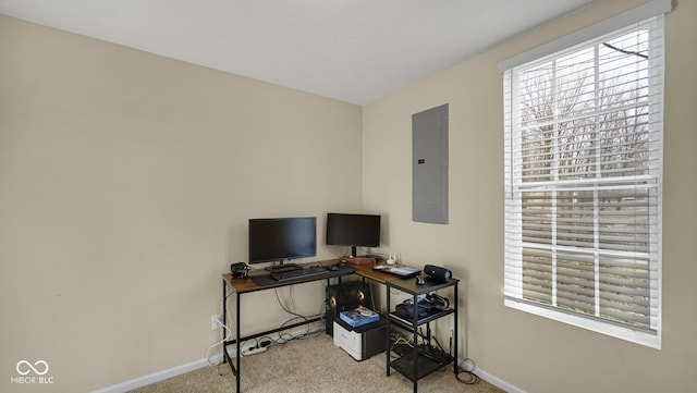 carpeted office featuring a healthy amount of sunlight and electric panel