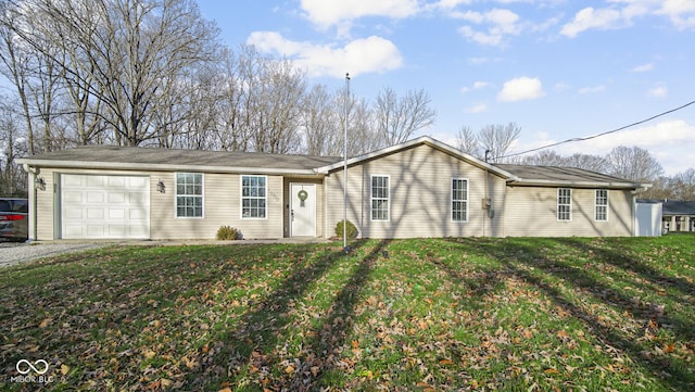 single story home with a garage and a front lawn