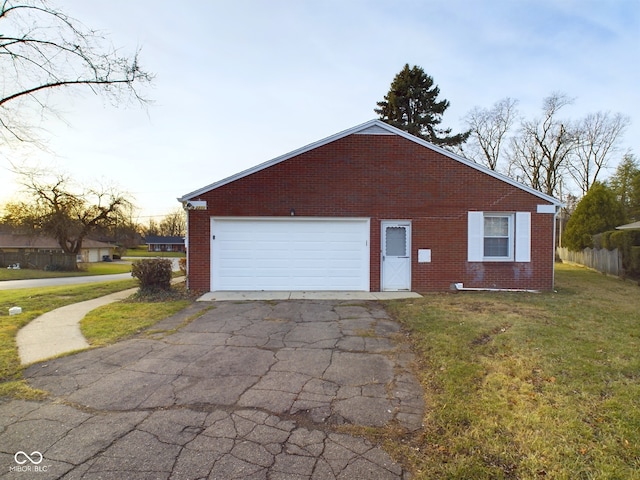 property exterior at dusk featuring a garage and a yard