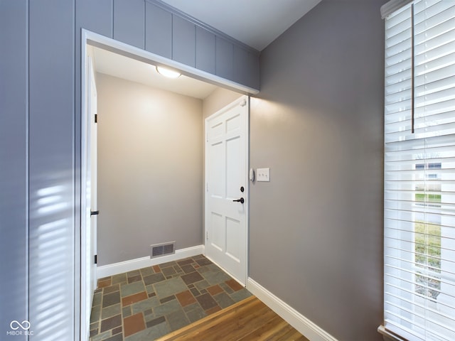 doorway to outside with dark hardwood / wood-style floors