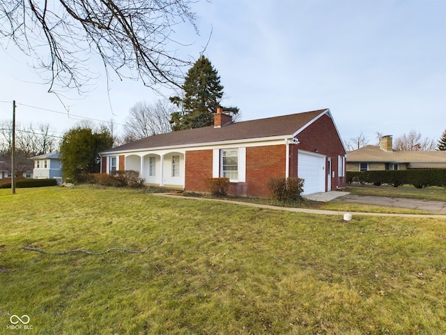 ranch-style house with a garage and a front yard