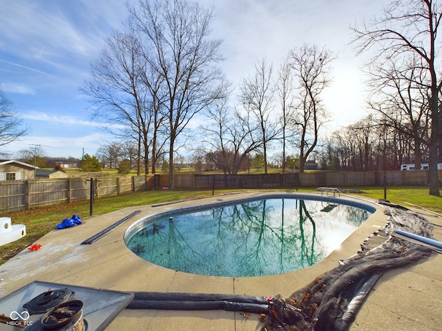 view of swimming pool featuring a diving board