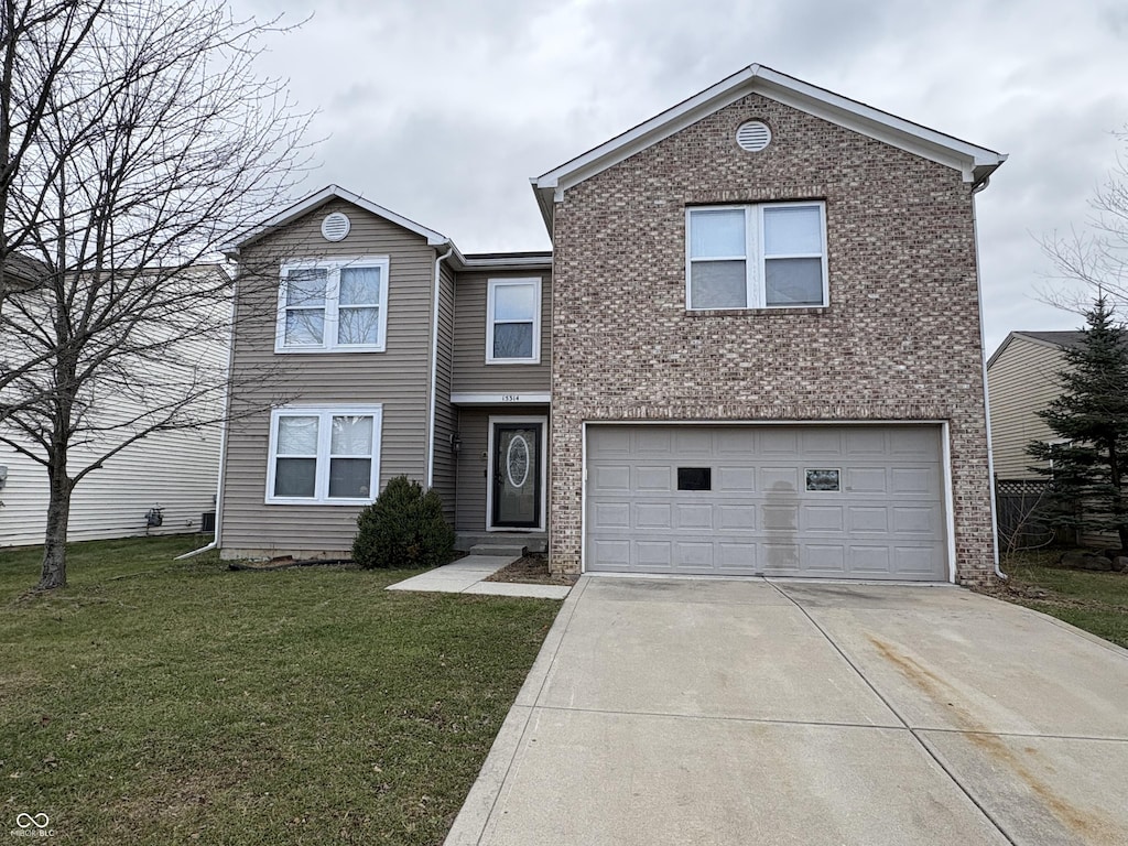 front facade with a front yard and a garage