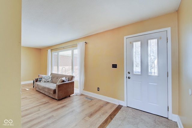 foyer entrance featuring light hardwood / wood-style flooring