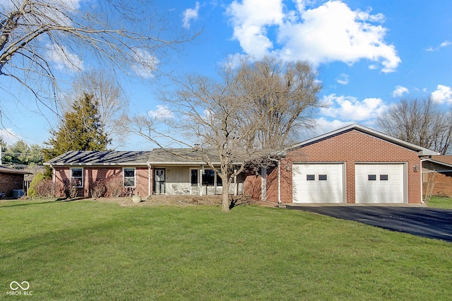 single story home featuring a front yard and a garage