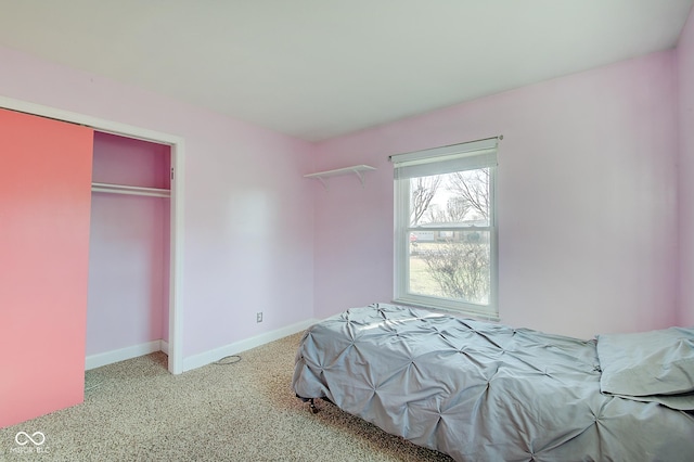 carpeted bedroom featuring a closet