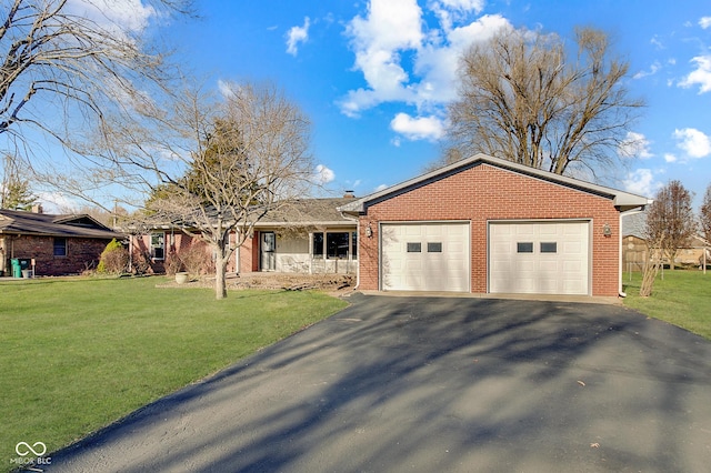 ranch-style home featuring a front yard and a garage