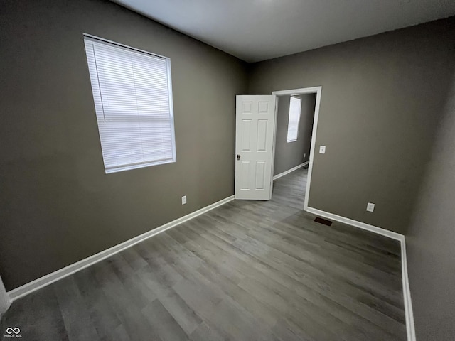 spare room with hardwood / wood-style flooring