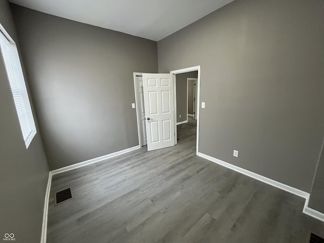 spare room with hardwood / wood-style floors and a healthy amount of sunlight