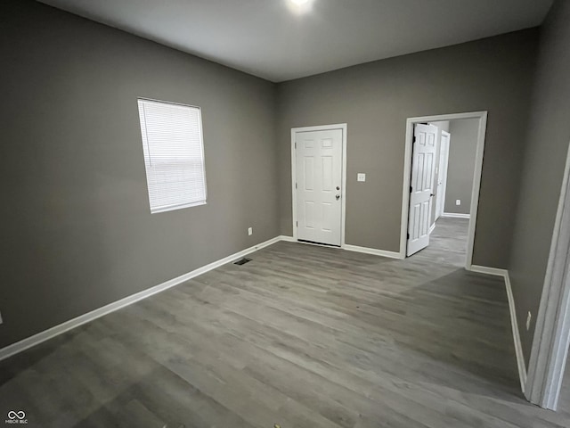 unfurnished bedroom featuring wood-type flooring