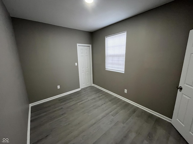 spare room with hardwood / wood-style floors