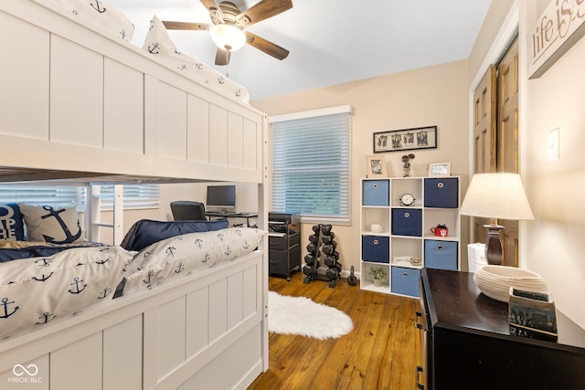 bedroom featuring hardwood / wood-style flooring and ceiling fan