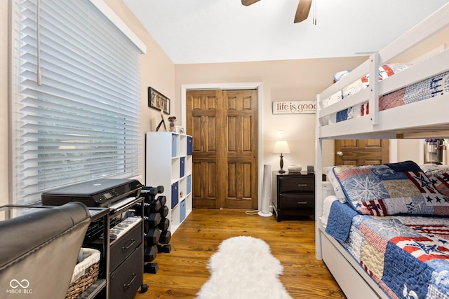 bedroom with ceiling fan, light wood-type flooring, and a closet