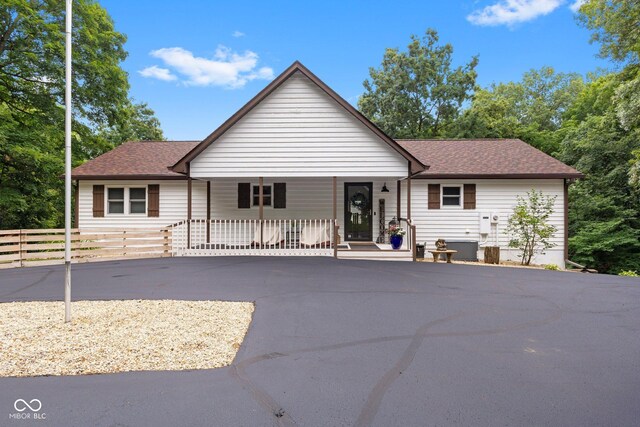 7701 Center Lake Rd, Nineveh, IN 46164 - ranch-style house with covered porch, a shingled roof, and driveway