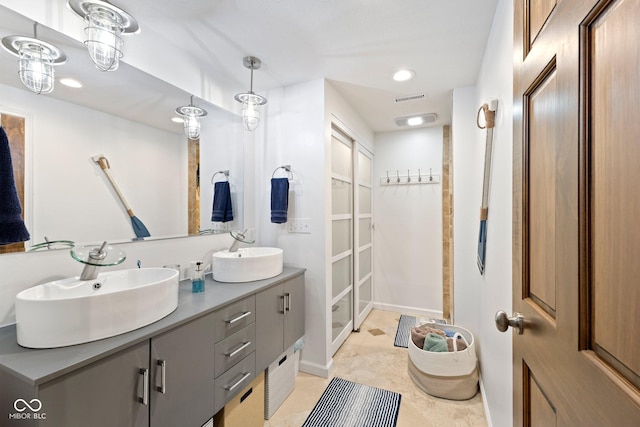 bathroom with tile patterned floors and vanity