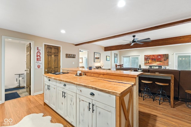 7701 Center Lake Rd, Nineveh, IN 46164 - kitchen with open floor plan, white cabinets, light wood finished floors, butcher block counters, and recessed lighting
