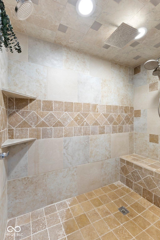 bathroom with tiled shower