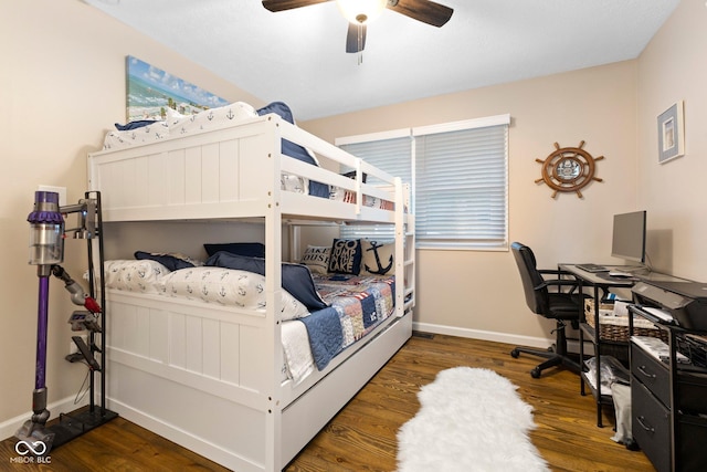 bedroom featuring ceiling fan and dark hardwood / wood-style floors