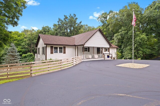 7701 Center Lake Rd, Nineveh, IN 46164 - ranch-style home featuring roof with shingles and asphalt driveway