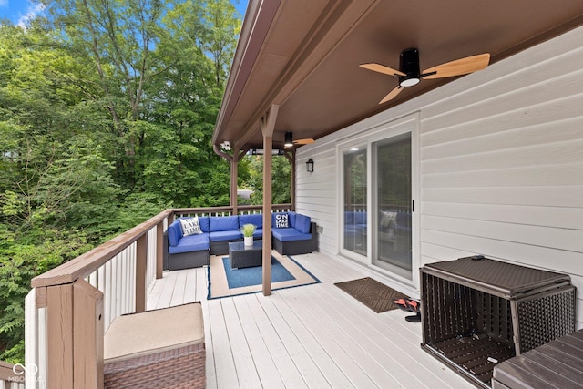 deck featuring an outdoor living space and ceiling fan