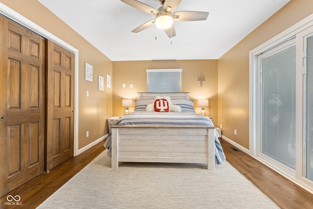 bedroom featuring a closet, ceiling fan, and dark wood-type flooring