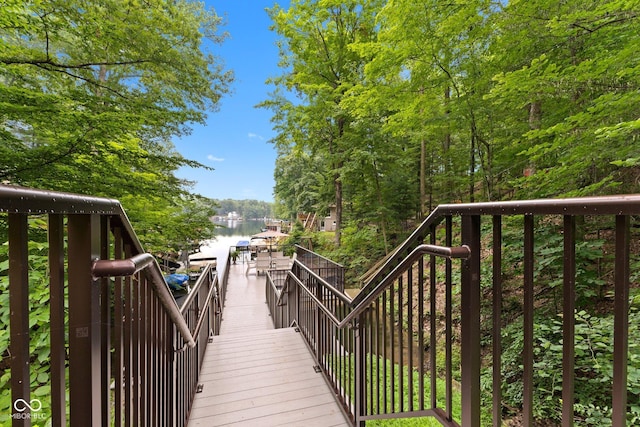 deck with a water view and a boat dock