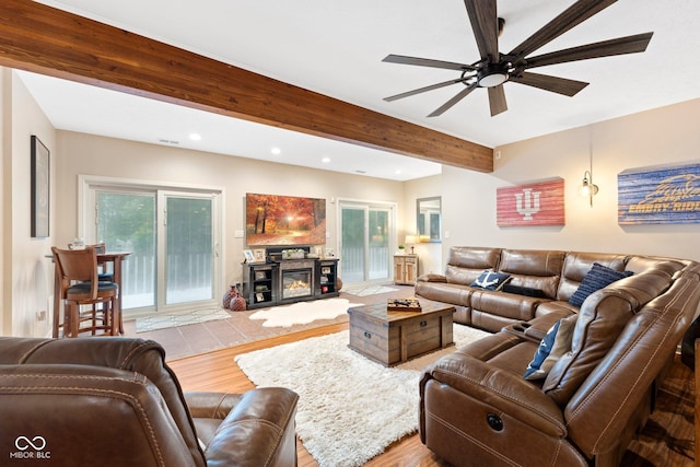 7701 Center Lake Rd, Nineveh, IN 46164 - living room with recessed lighting, beam ceiling, wood finished floors, a ceiling fan, and a glass covered fireplace