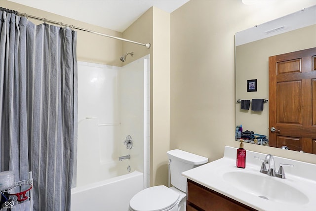 full bathroom featuring shower / tub combo with curtain, vanity, and toilet