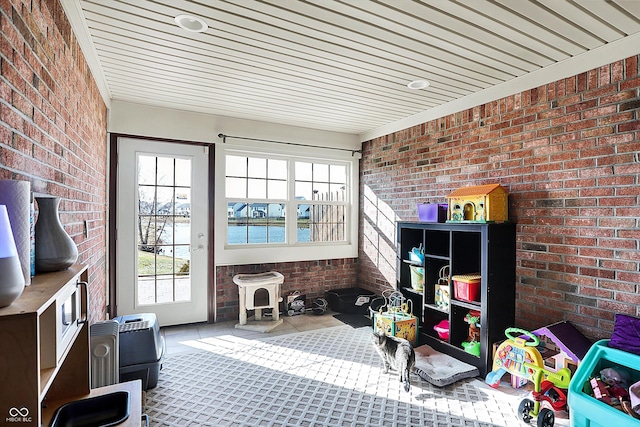 sunroom with a water view and a wealth of natural light