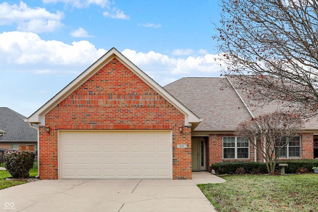 front facade featuring a front yard and a garage