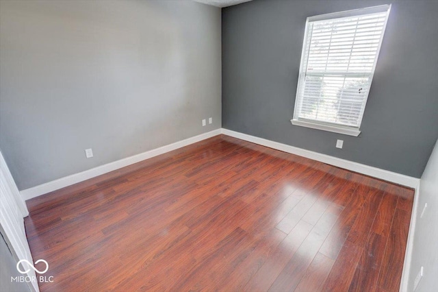 empty room featuring dark hardwood / wood-style floors