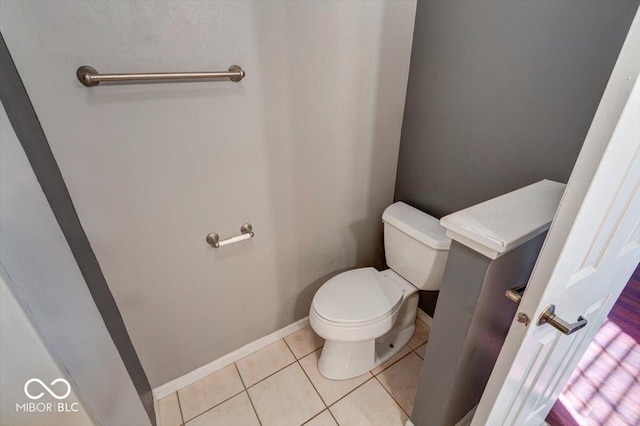 bathroom featuring tile patterned flooring and toilet