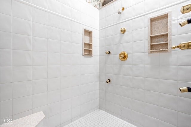 bathroom with tiled shower