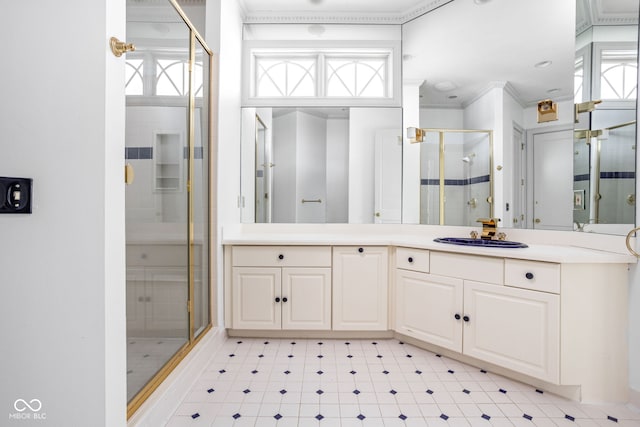 bathroom with crown molding, vanity, and an enclosed shower