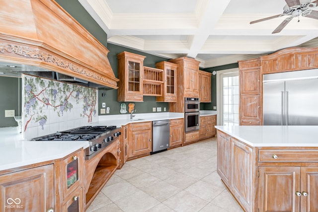 kitchen with backsplash, crown molding, appliances with stainless steel finishes, beamed ceiling, and custom range hood