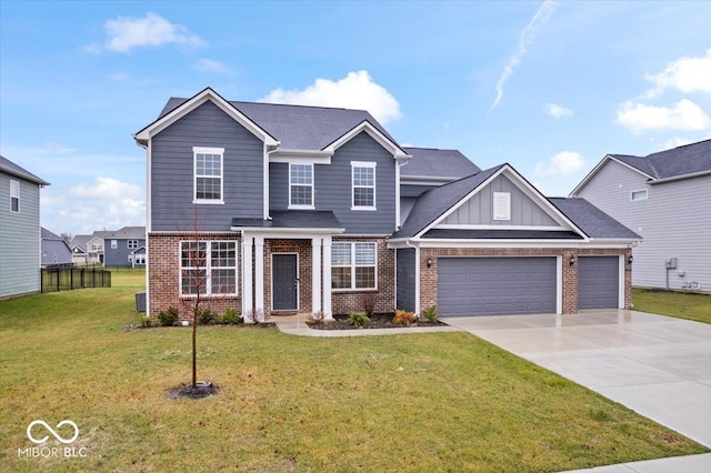 view of front of house featuring a garage and a front lawn