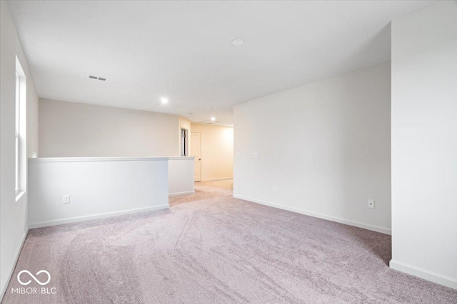 empty room with light colored carpet