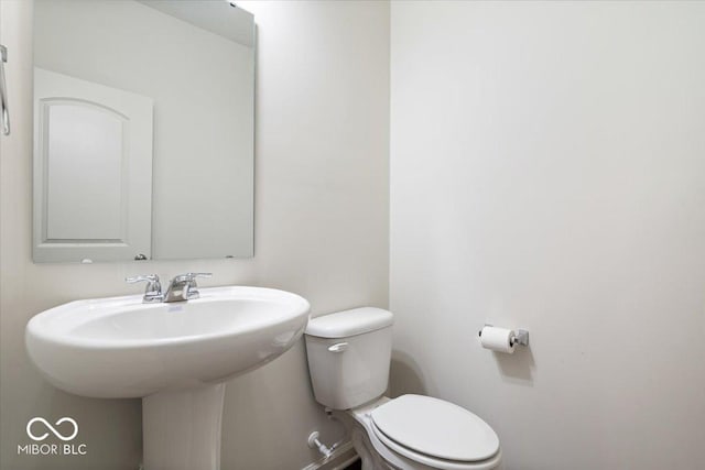 bathroom with sink and toilet