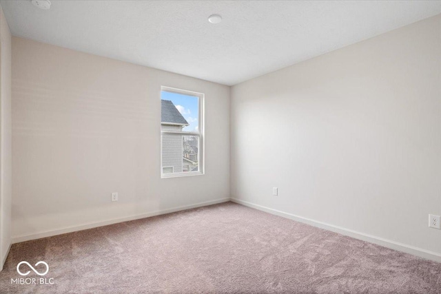 unfurnished room with carpet flooring