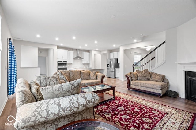 living room with light hardwood / wood-style flooring