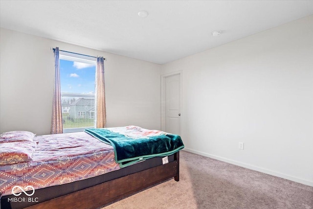 bedroom with light colored carpet