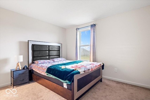 bedroom with light carpet