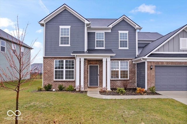 view of front of property with a front lawn and a garage