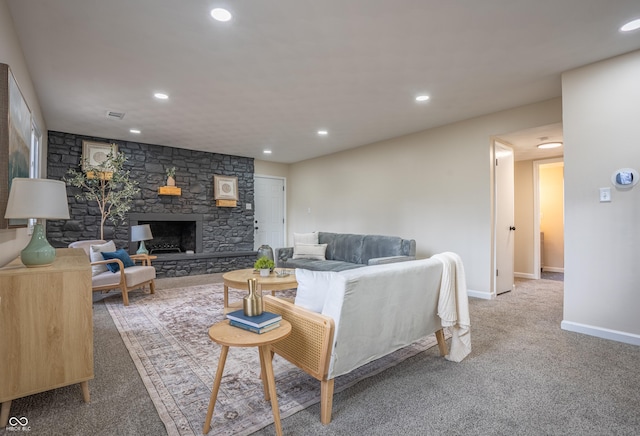 living room featuring carpet flooring and a fireplace