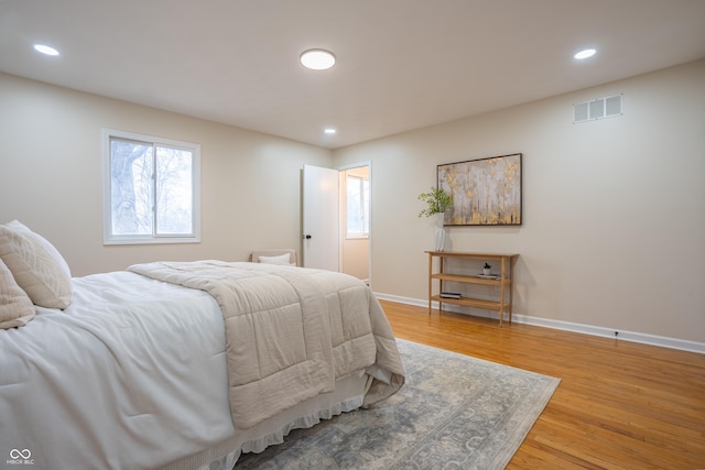 bedroom with hardwood / wood-style flooring