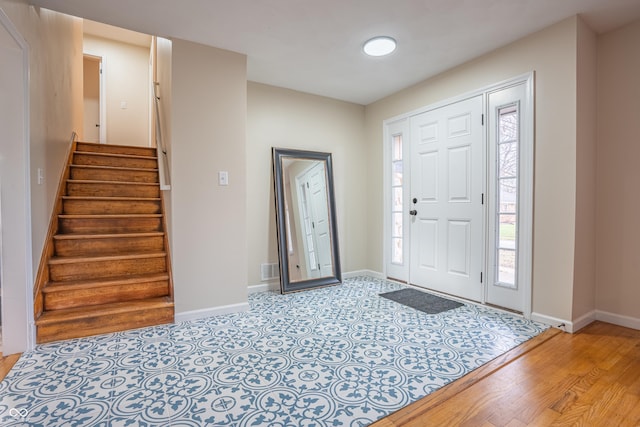 entryway with light hardwood / wood-style floors