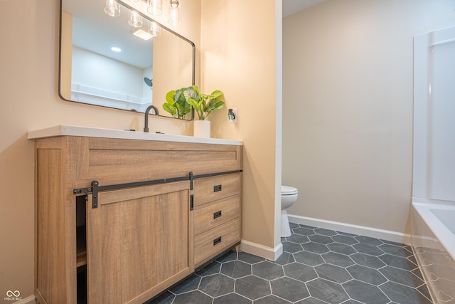 bathroom with vanity and toilet