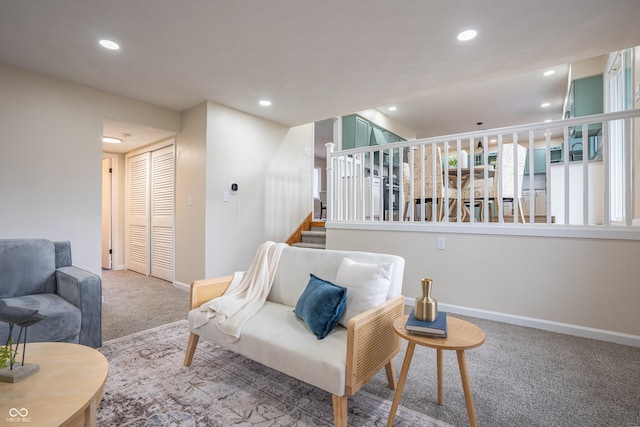 living area with carpet