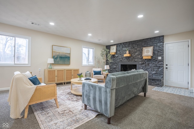 living room featuring carpet flooring and a fireplace